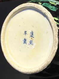 A Chinese verte biscuit black-ground vase and a covered jar, Xuande and Kangxi mark, 19th C.