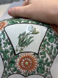 A pair of Chinese famille verte 'Floral' jars with wooden covers, 19th C.