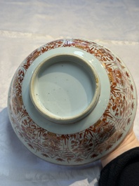 A pair of Chinese  iron-red and gilt-decorated 'Elegant Ladies and Tulips' bowls and covers, Kangxi