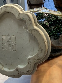 A Chinese verte biscuit black-ground vase and a covered jar, Xuande and Kangxi mark, 19th C.