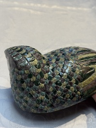 A pair of Chinese turquoise-glazed ducks and a pair of verte biscuit quail-form covered boxes, 20th C.