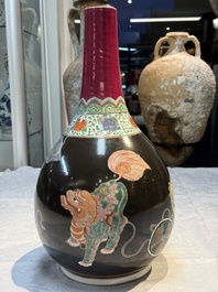 A rare Chinese famille verte black- and ruby-ground 'Buddhist Lions' vase, Kangxi