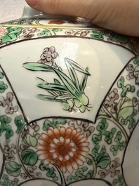 A pair of Chinese famille verte 'Floral' jars with wooden covers, 19th C.