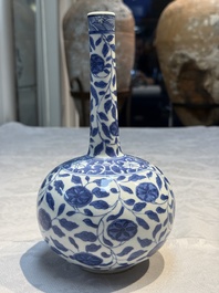 A rare Chinese 'G-marked' blue and white bottle vase with floral design, Kangxi