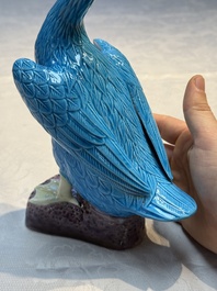 A pair of Chinese turquoise-glazed ducks and a pair of verte biscuit quail-form covered boxes, 20th C.