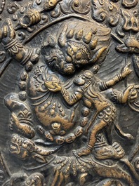 Three Tibetan copper repouss&eacute; plaques with Buddhist subjects, 19th C.