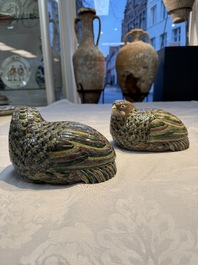 A pair of Chinese turquoise-glazed ducks and a pair of verte biscuit quail-form covered boxes, 20th C.