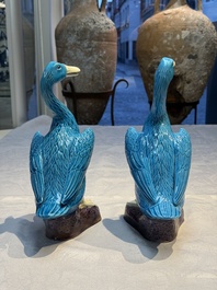 A pair of Chinese turquoise-glazed ducks and a pair of verte biscuit quail-form covered boxes, 20th C.