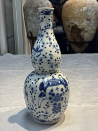 Three Chinese blue and white vases, one covered, Kangxi mark, 19th C. and later
