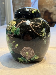 A Chinese verte biscuit black-ground vase and a covered jar, Xuande and Kangxi mark, 19th C.