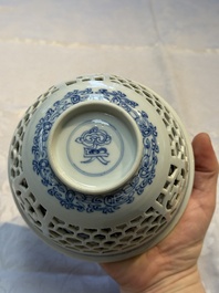 A Chinese blue and white reticulated double-walled 'Swastika' bowl, Kangxi