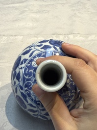 A rare Chinese 'G-marked' blue and white bottle vase with floral design, Kangxi