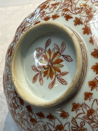 A pair of Chinese  iron-red and gilt-decorated 'Elegant Ladies and Tulips' bowls and covers, Kangxi