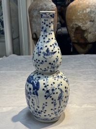 Three Chinese blue and white vases, one covered, Kangxi mark, 19th C. and later