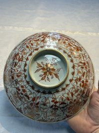 A pair of Chinese  iron-red and gilt-decorated 'Elegant Ladies and Tulips' bowls and covers, Kangxi