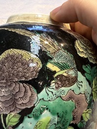 A Chinese verte biscuit black-ground vase and a covered jar, Xuande and Kangxi mark, 19th C.