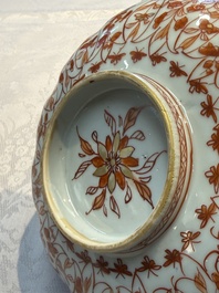 A pair of Chinese  iron-red and gilt-decorated 'Elegant Ladies and Tulips' bowls and covers, Kangxi