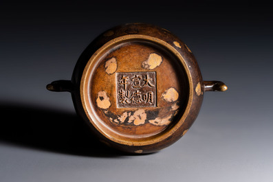 A Chinese gold-splashed bronze censer with two handles, Xuande mark, 18th C.