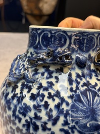 Three Chinese blue and white vases, one covered, Kangxi mark, 19th C. and later