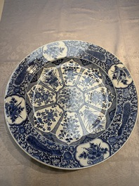 A pair of large Chinese blue and white 'Peacock Border' chargers with floral design, Kangxi