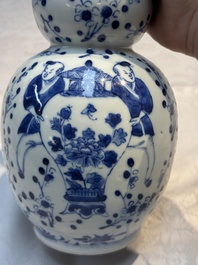 Three Chinese blue and white vases, one covered, Kangxi mark, 19th C. and later