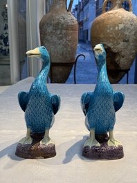 A pair of Chinese turquoise-glazed ducks and a pair of verte biscuit quail-form covered boxes, 20th C.