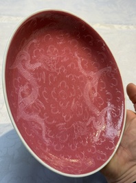 Four Chinese sgraffito ruby-ground 'Dragon' cups and three plates, Qianlong mark, Republic