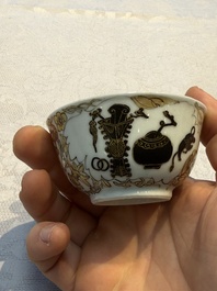A Chinese gilt-decorated black-enamelled 'Antiquities' cup, Yongzheng/Qianlong