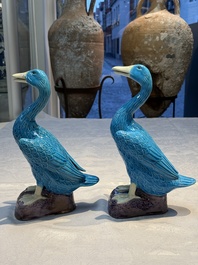 A pair of Chinese turquoise-glazed ducks and a pair of verte biscuit quail-form covered boxes, 20th C.