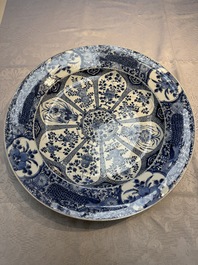 A pair of large Chinese blue and white 'Peacock Border' chargers with floral design, Kangxi