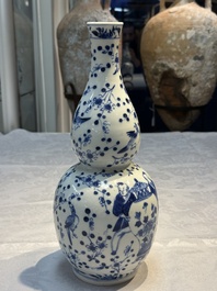 Three Chinese blue and white vases, one covered, Kangxi mark, 19th C. and later