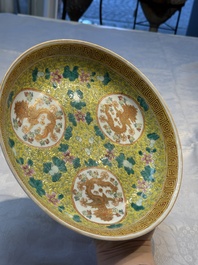 A Chinese famille rose 'Millefleurs' plate, a 'Dragons' plate, and a Nanking famille verte caf&eacute;-au-lait-ground bowl, Qianlong marks, 19/20th C.