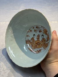 A pair of Chinese  iron-red and gilt-decorated 'Elegant Ladies and Tulips' bowls and covers, Kangxi
