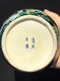 A Chinese verte biscuit black-ground vase and a covered jar, Xuande and Kangxi mark, 19th C.