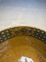 A Chinese famille rose 'Millefleurs' plate, a 'Dragons' plate, and a Nanking famille verte caf&eacute;-au-lait-ground bowl, Qianlong marks, 19/20th C.