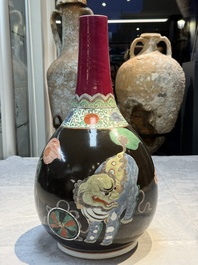 A rare Chinese famille verte black- and ruby-ground 'Buddhist Lions' vase, Kangxi