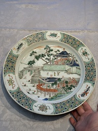 A Chinese famille verte 'Pavilions and Lotus Pond' dish, swastika mark, Kangxi