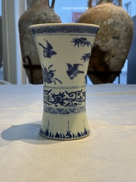 A Chinese blue and white 'Gu' vase with birds among flowering branches, Jiajing mark, 19th C.