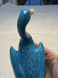 A pair of Chinese turquoise-glazed ducks and a pair of verte biscuit quail-form covered boxes, 20th C.