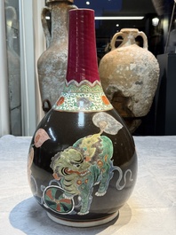 A rare Chinese famille verte black- and ruby-ground 'Buddhist Lions' vase, Kangxi
