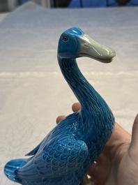 A pair of Chinese turquoise-glazed ducks and a pair of verte biscuit quail-form covered boxes, 20th C.