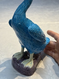 A pair of Chinese turquoise-glazed ducks and a pair of verte biscuit quail-form covered boxes, 20th C.