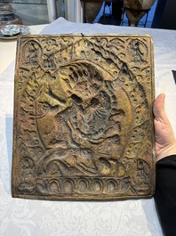 Three Tibetan copper repouss&eacute; plaques with Buddhist subjects, 19th C.