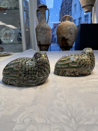 A pair of Chinese turquoise-glazed ducks and a pair of verte biscuit quail-form covered boxes, 20th C.
