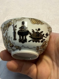 A Chinese gilt-decorated black-enamelled 'Antiquities' cup, Yongzheng/Qianlong