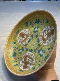 A Chinese famille rose 'Millefleurs' plate, a 'Dragons' plate, and a Nanking famille verte caf&eacute;-au-lait-ground bowl, Qianlong marks, 19/20th C.