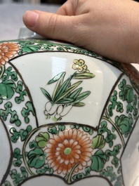 A pair of Chinese famille verte 'Floral' jars with wooden covers, 19th C.