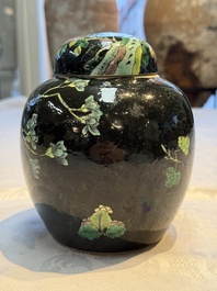 A Chinese verte biscuit black-ground vase and a covered jar, Xuande and Kangxi mark, 19th C.