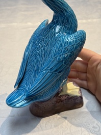 A pair of Chinese turquoise-glazed ducks and a pair of verte biscuit quail-form covered boxes, 20th C.