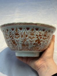 A pair of Chinese  iron-red and gilt-decorated 'Elegant Ladies and Tulips' bowls and covers, Kangxi